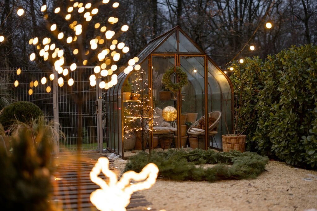 Beautiful backyard with vintage glasshouse and Christmas wreath on winter